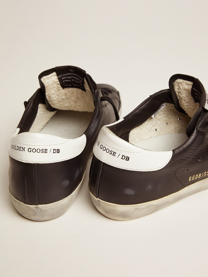 Golden Goose Women’s Super-Star in black leather with white leather star and heel tab outlook