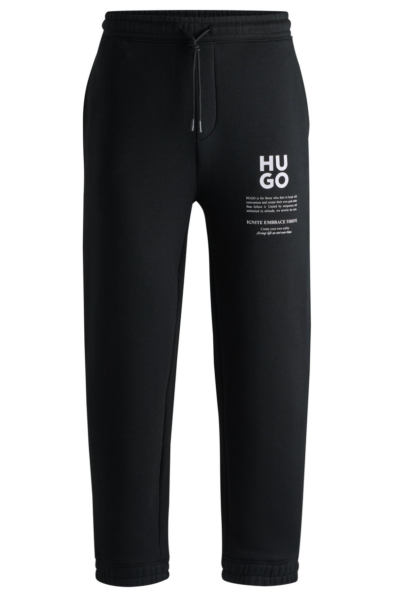 RELAXED-FIT TRACKSUIT BOTTOMS WITH LOGO AND SLOGANS - 1