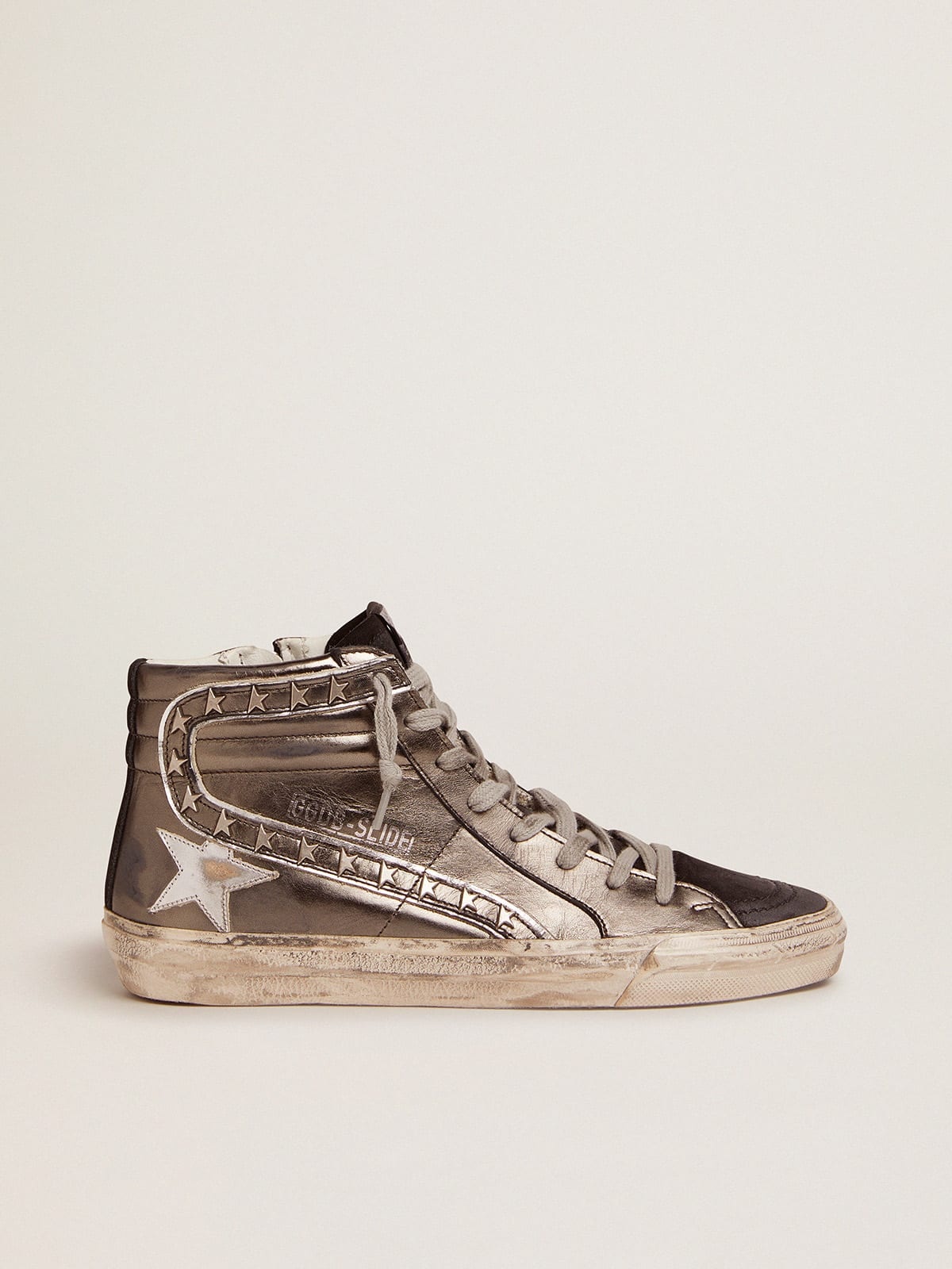 Slide sneakers with silver laminated leather upper and star-shaped studs - 1