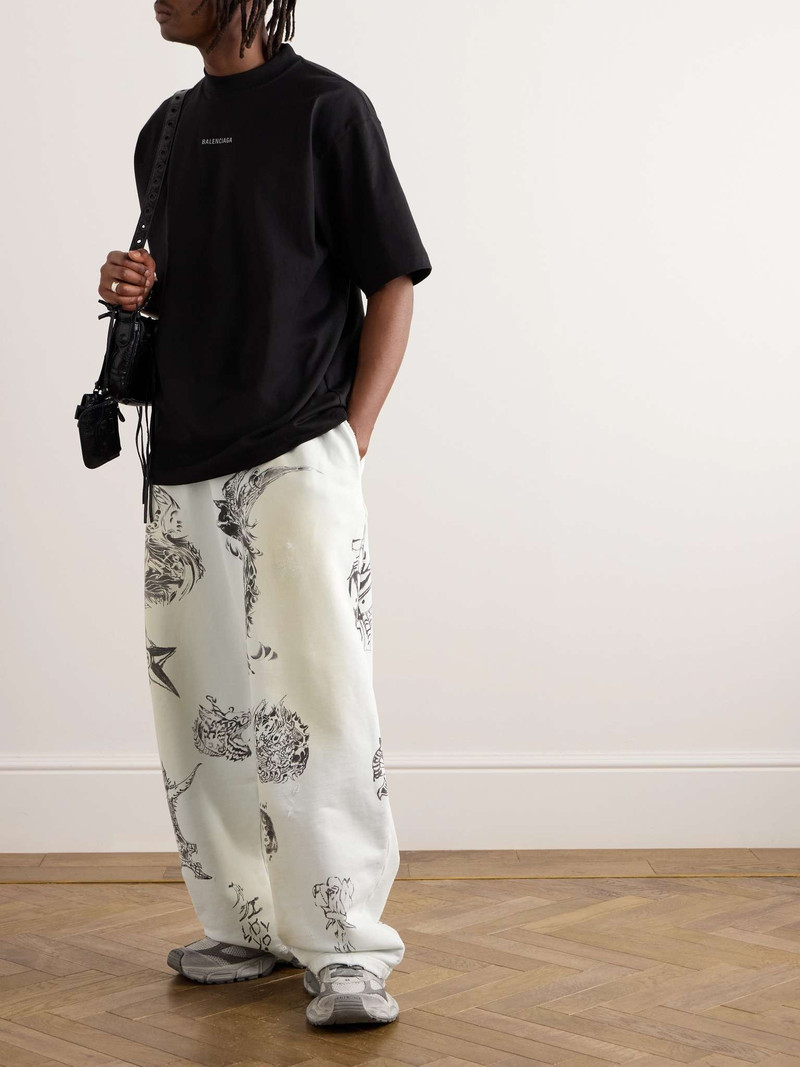 BALENCIAGA Wide-Leg Printed Distressed Cotton-Jersey Sweatpants outlook