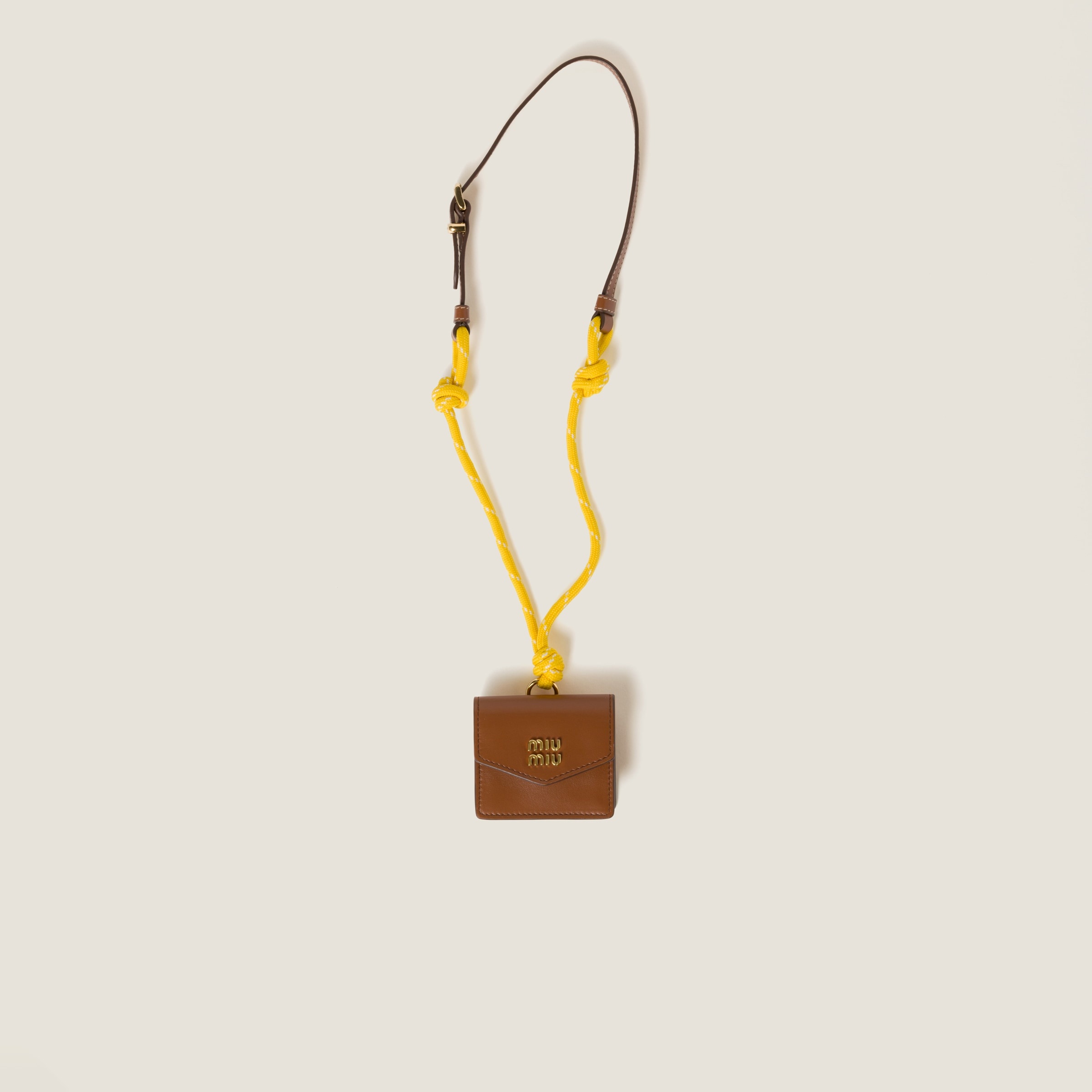 Leather, cord, and metal trick with mini-pouch - 1