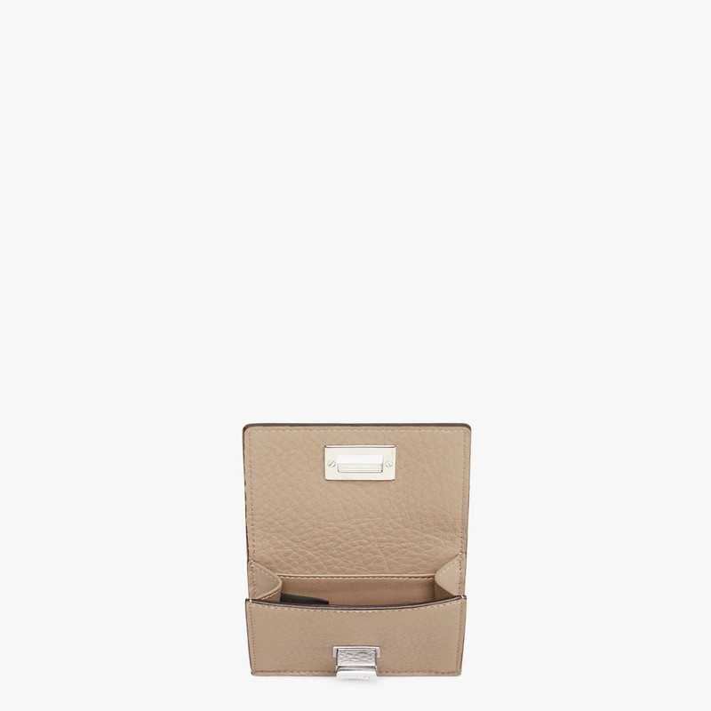 FENDI Compact, tri-fold Peekaboo Selleria wallet with large internal bill compartment and three concealed  outlook