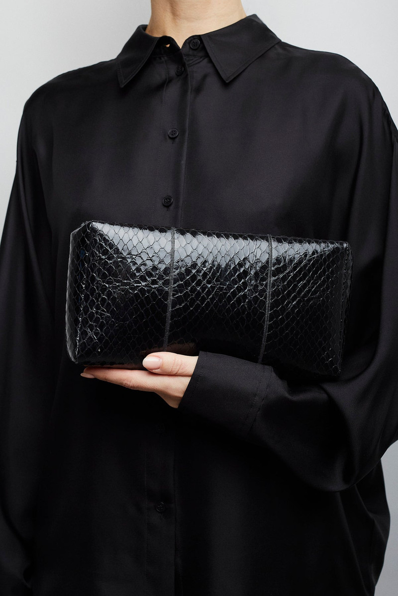 The Row Squared compact black leather clutch outlook