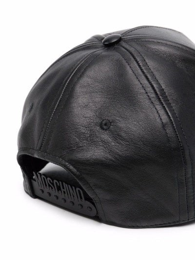 Moschino logo-print leather cap outlook