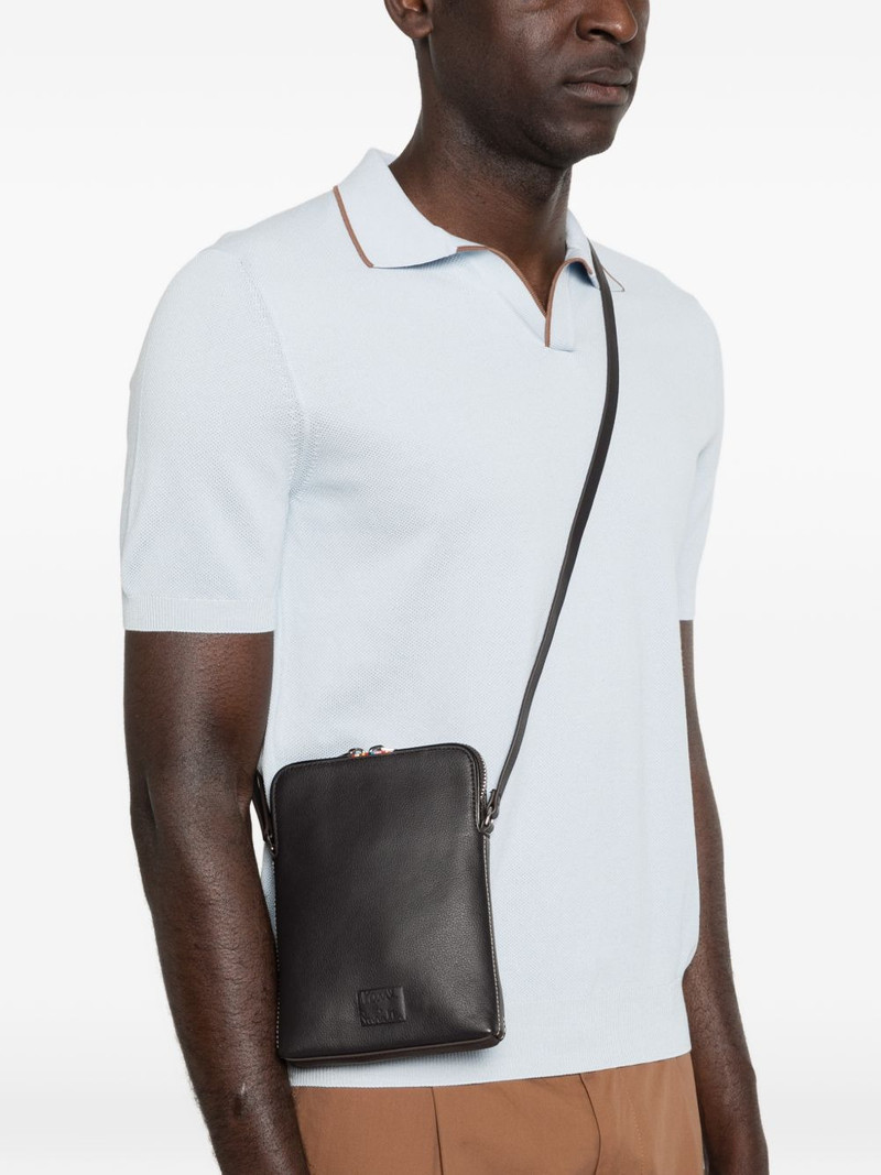Paul Smith embossed-logo leather messenger bag outlook