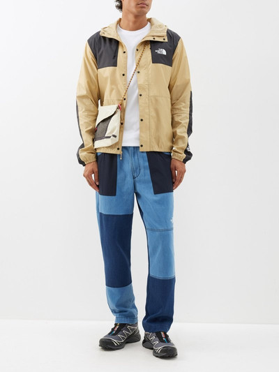 The North Face Patchwork belted-waist denim trousers outlook