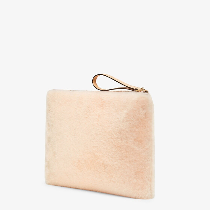 FENDI Large pouch with removable bracelet handle. Zip fastening. Made of pink sheepskin. Embellished with  outlook