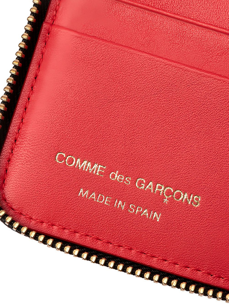 Comme Des Garçons embossed zip-around wallet outlook