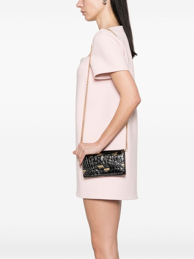 Moschino debossed-logo clutch bag outlook