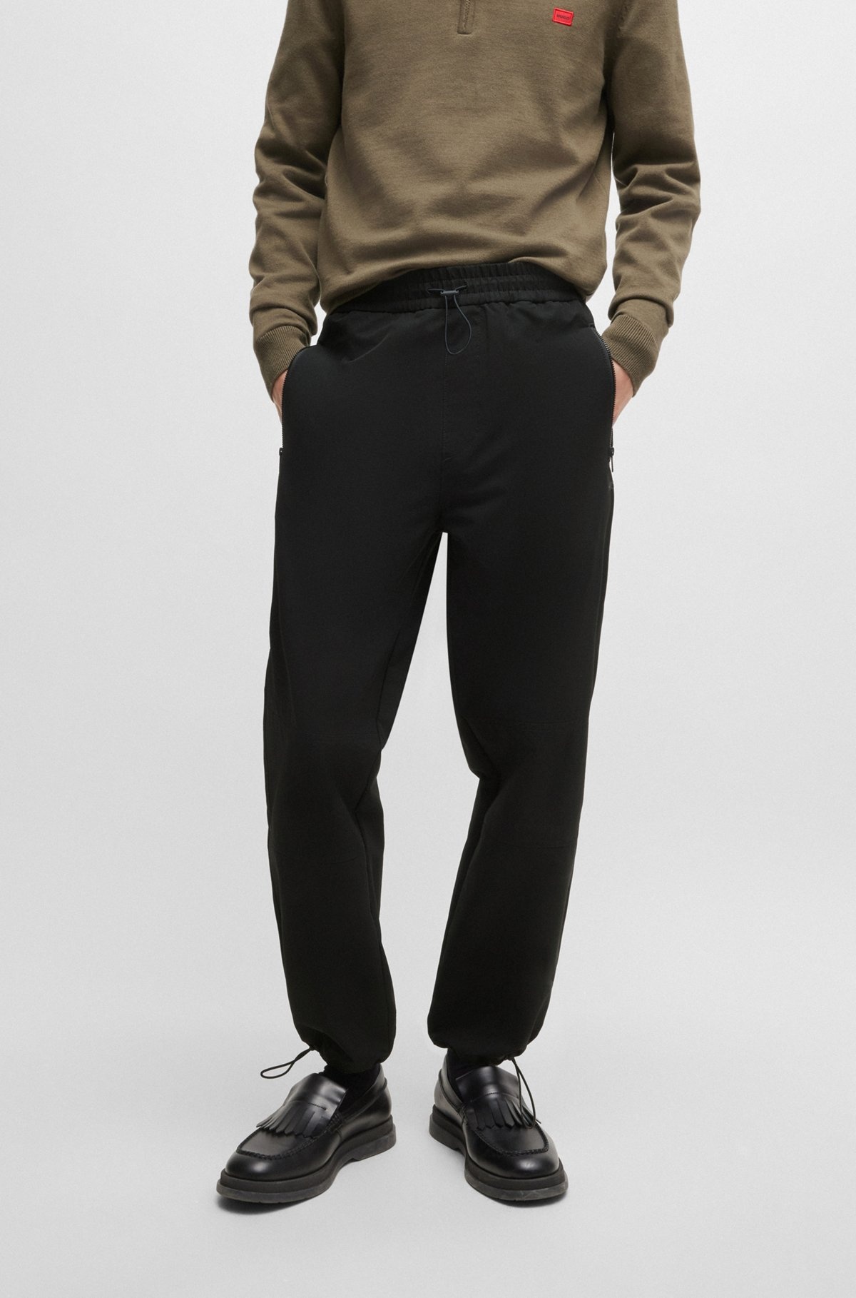 WATER-REPELLENT TROUSERS WITH ADJUSTABLE HEMS - 2