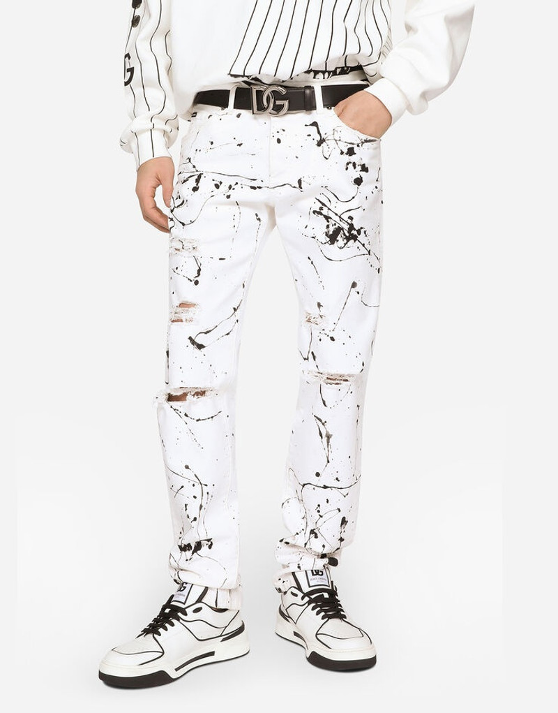 Slim-fit stretch jeans with rips and splash design 4