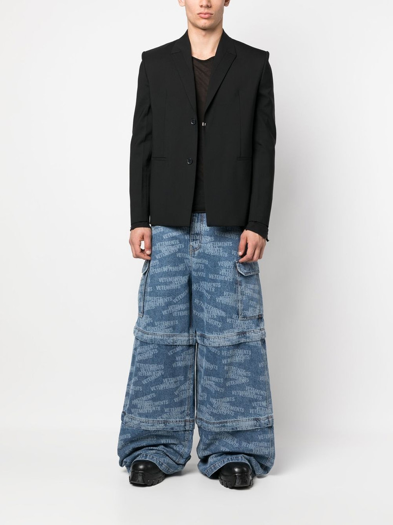 VETEMENTS Transformer logo-print jeans outlook