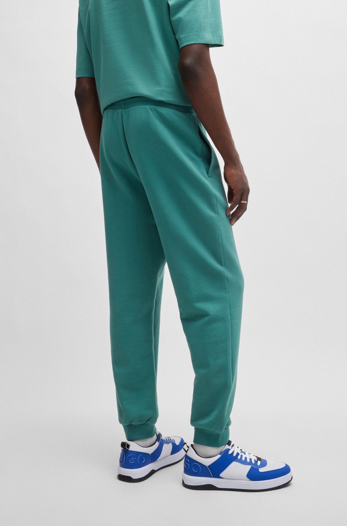 COTTON-TERRY TRACKSUIT BOTTOMS WITH HAPPY HUGO LOGO PATCH - 5