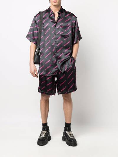 VETEMENTS logo-print track shorts outlook