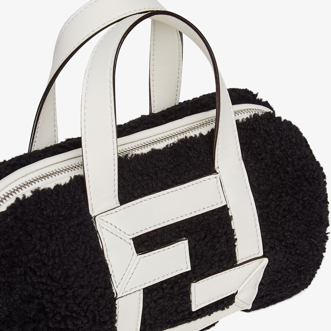 Mini bowling bag made of black sheepskin with white leather appliqués which create an FF motif. Line - 5