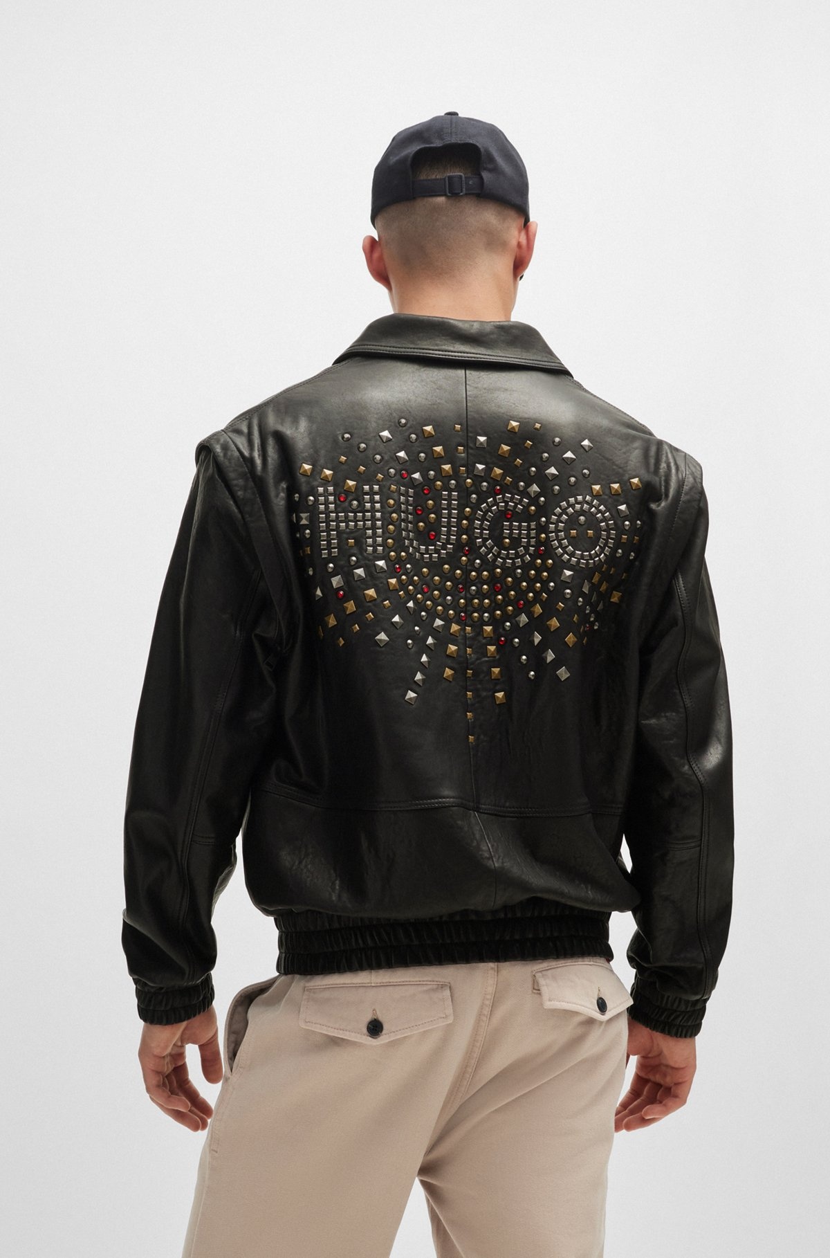 LEATHER JACKET WITH DETACHABLE SLEEVES AND STUD ARTWORK - 4