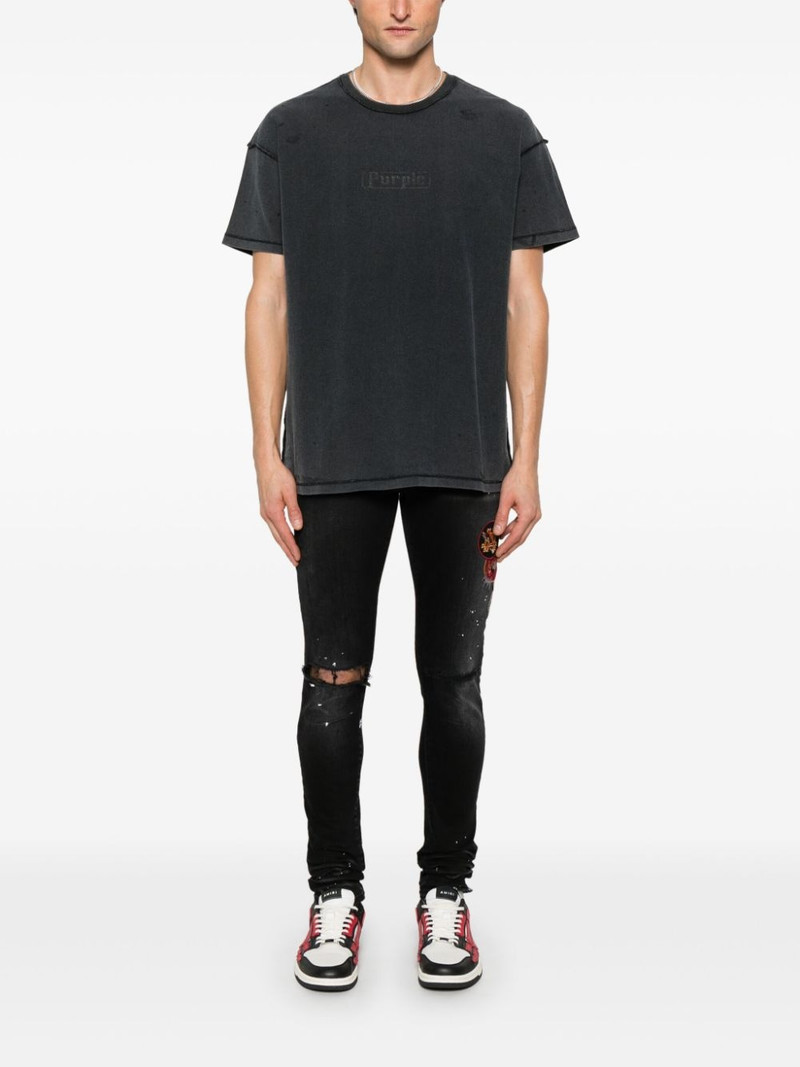 AMIRI patch-detailing skinny jeans outlook