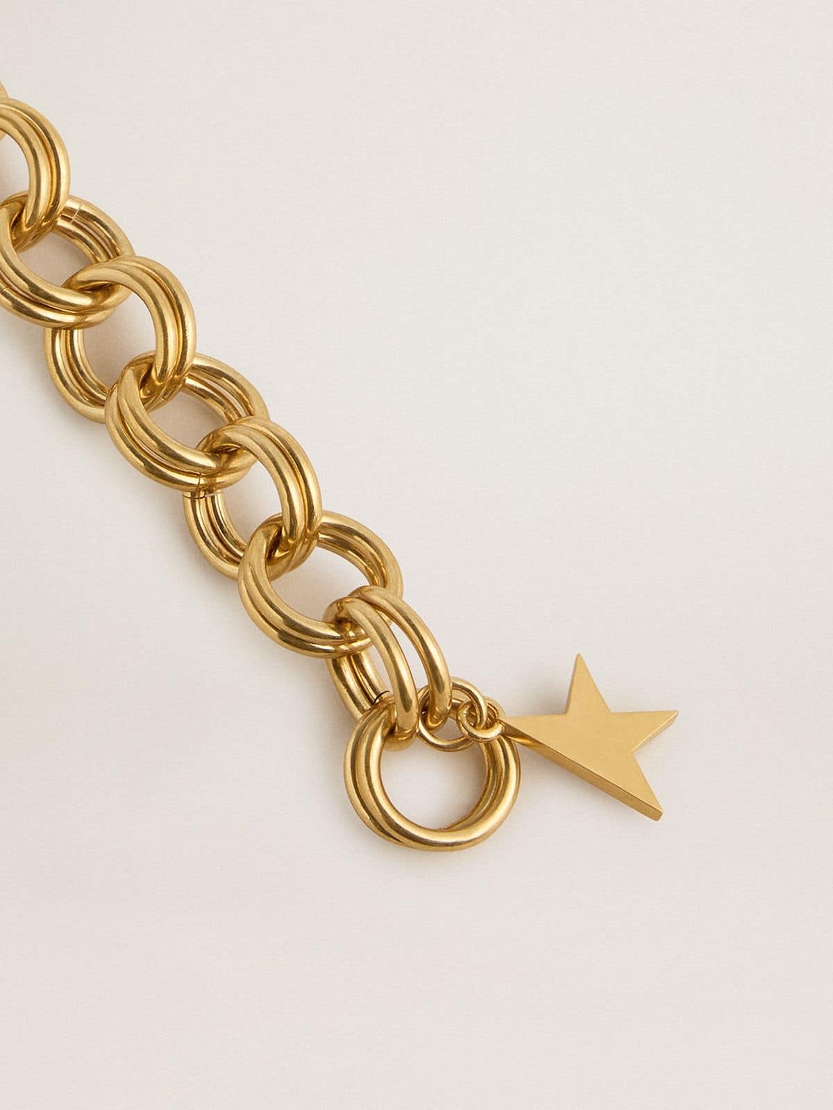 Antique gold-colored woven chain bracelet with star-shaped clasp - 2