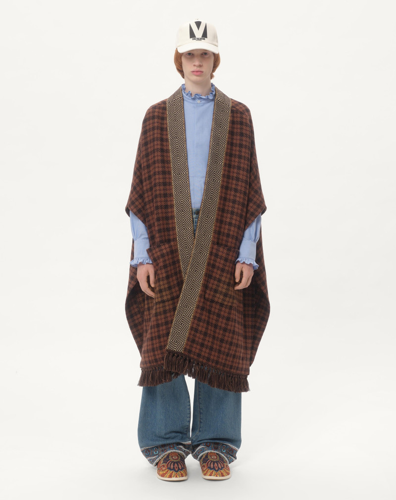 WOOL CAPE WITH JACQUARD TRIM AND TASSELS ON THE HEM 6