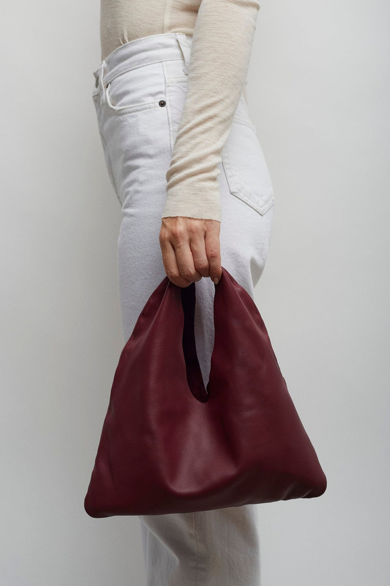 The Row Bindle small burgundy leather bag outlook