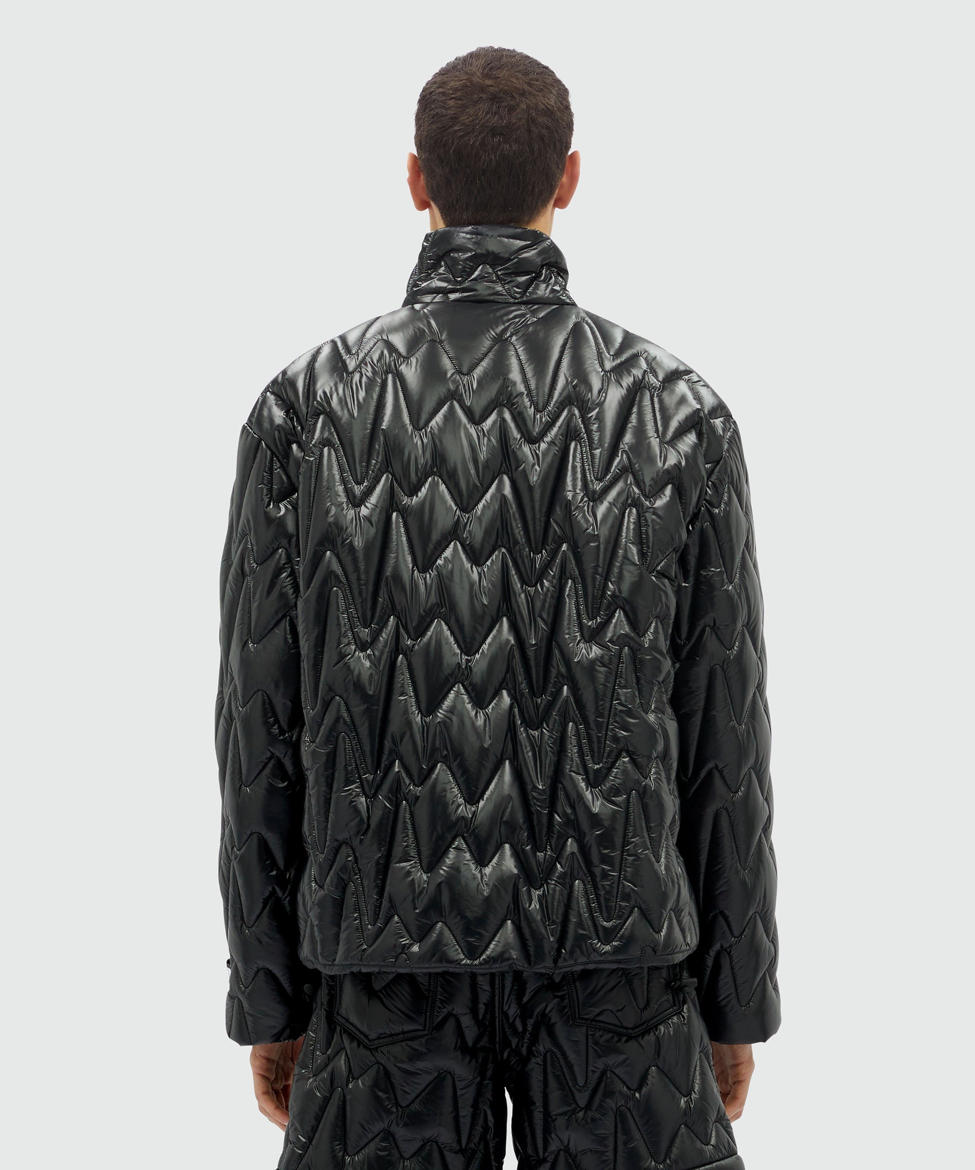 Black quilted jacket with "TheMwave" motif - 3