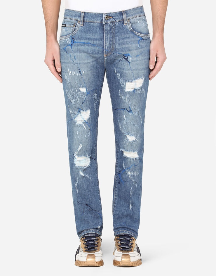 Washed blue skinny stretch jeans with rips and brushstrokes - 1