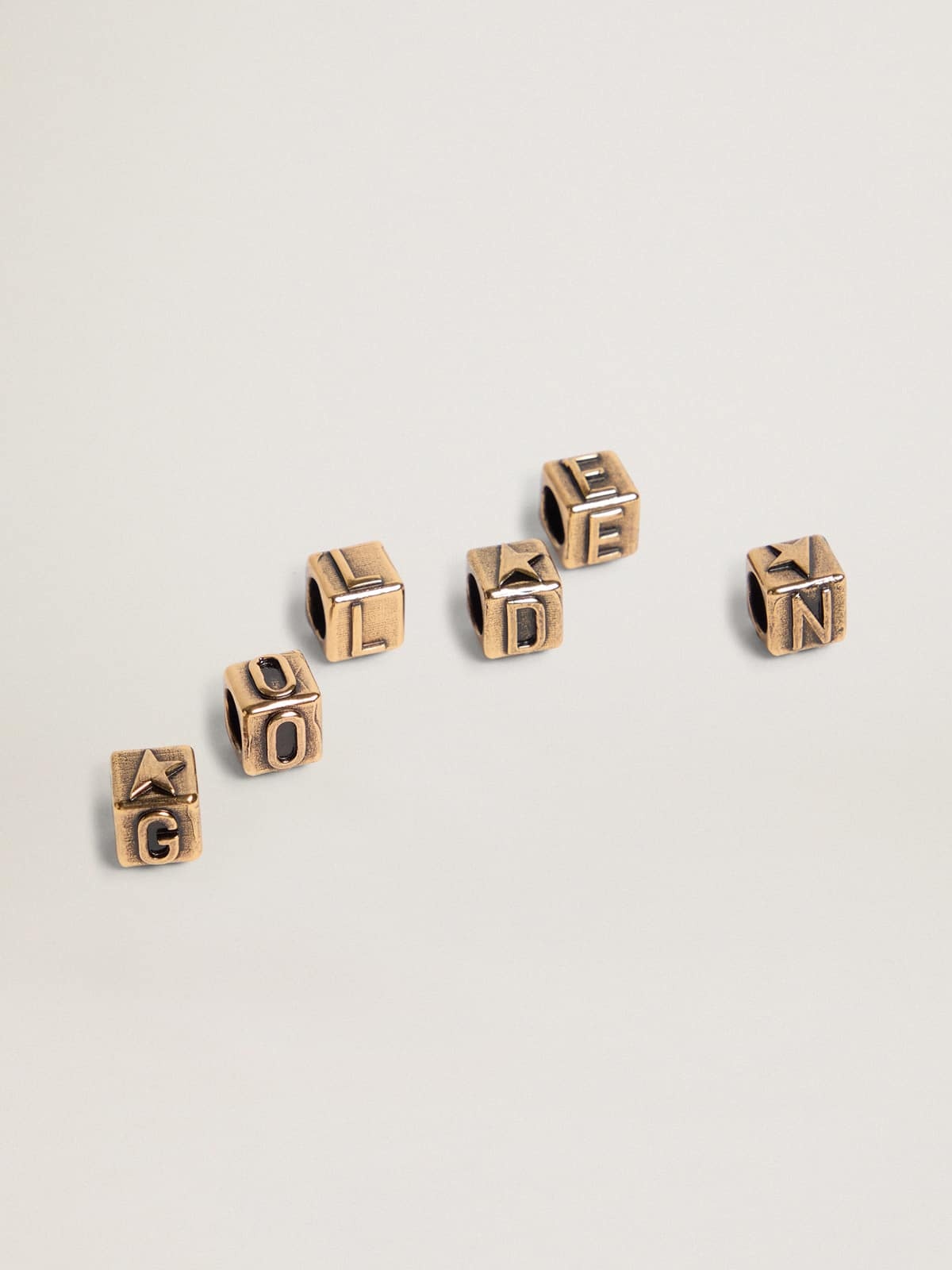 Women's cubic charms in antique gold color with letters of the alphabet - 1