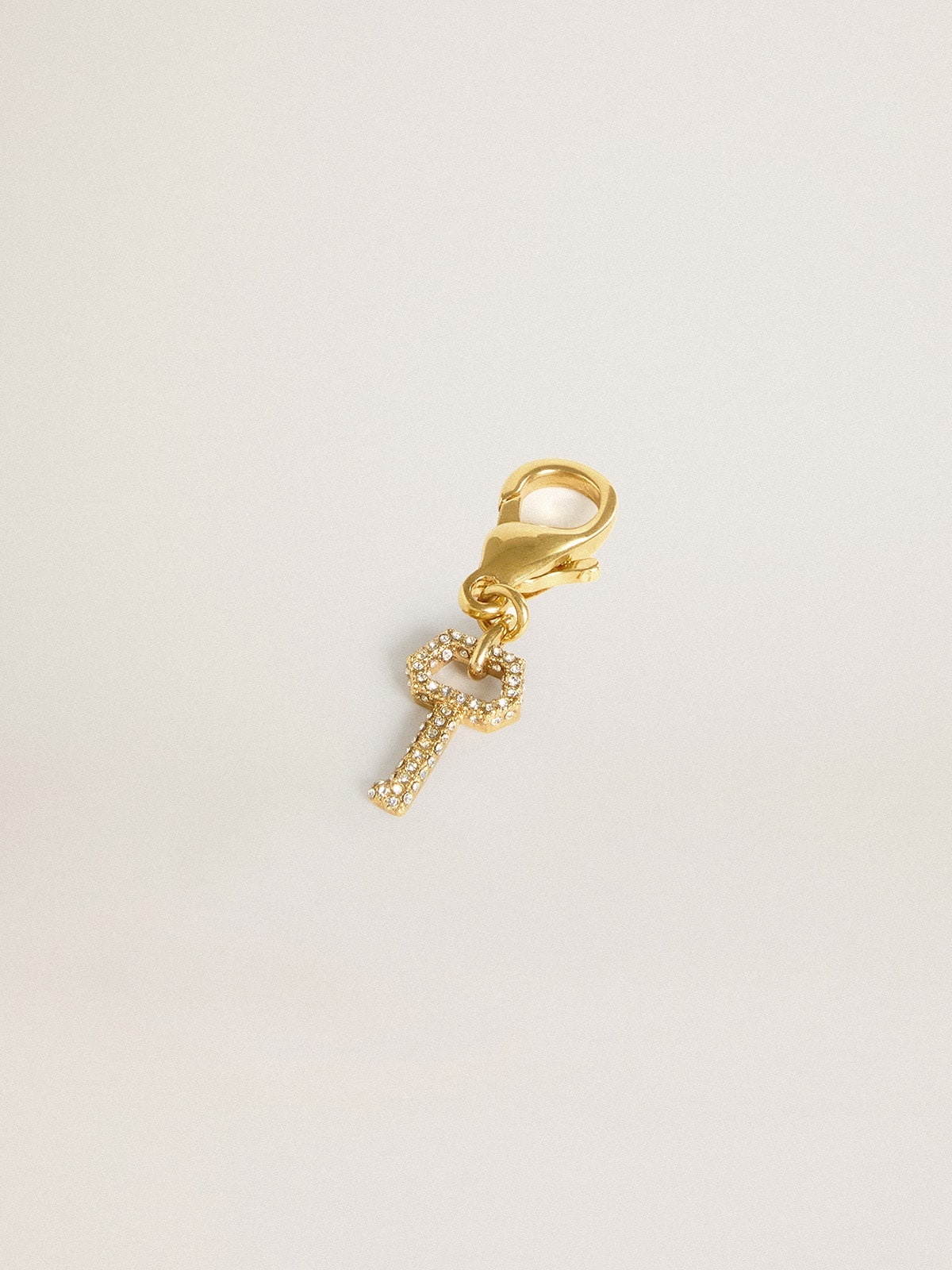 Key-shaped charm in gold-colored brass with crystals - 2