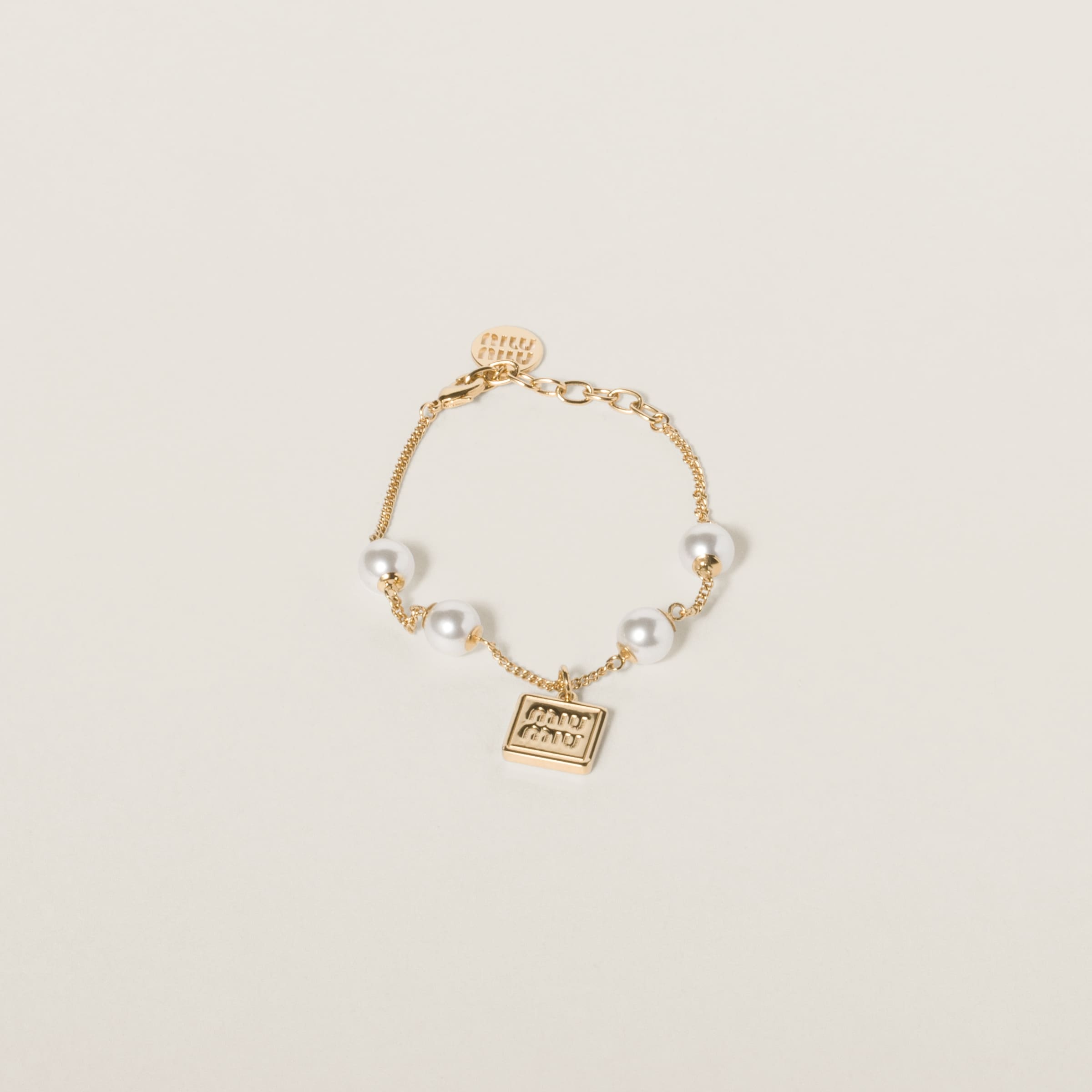 Metal bracelet with synthetic pearls - 1