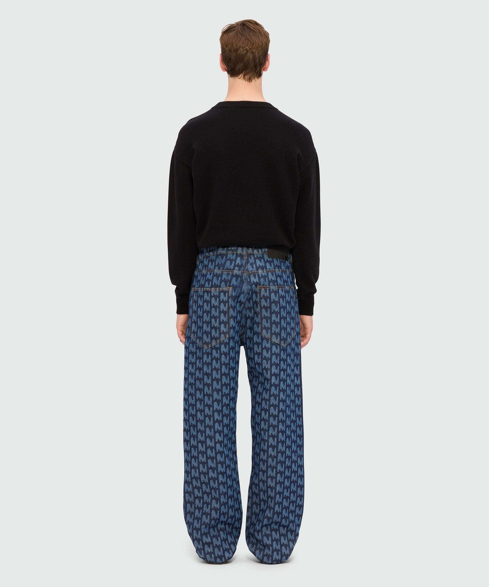 Blue laser-cut denim trousers with "TheMwave" motif - 3