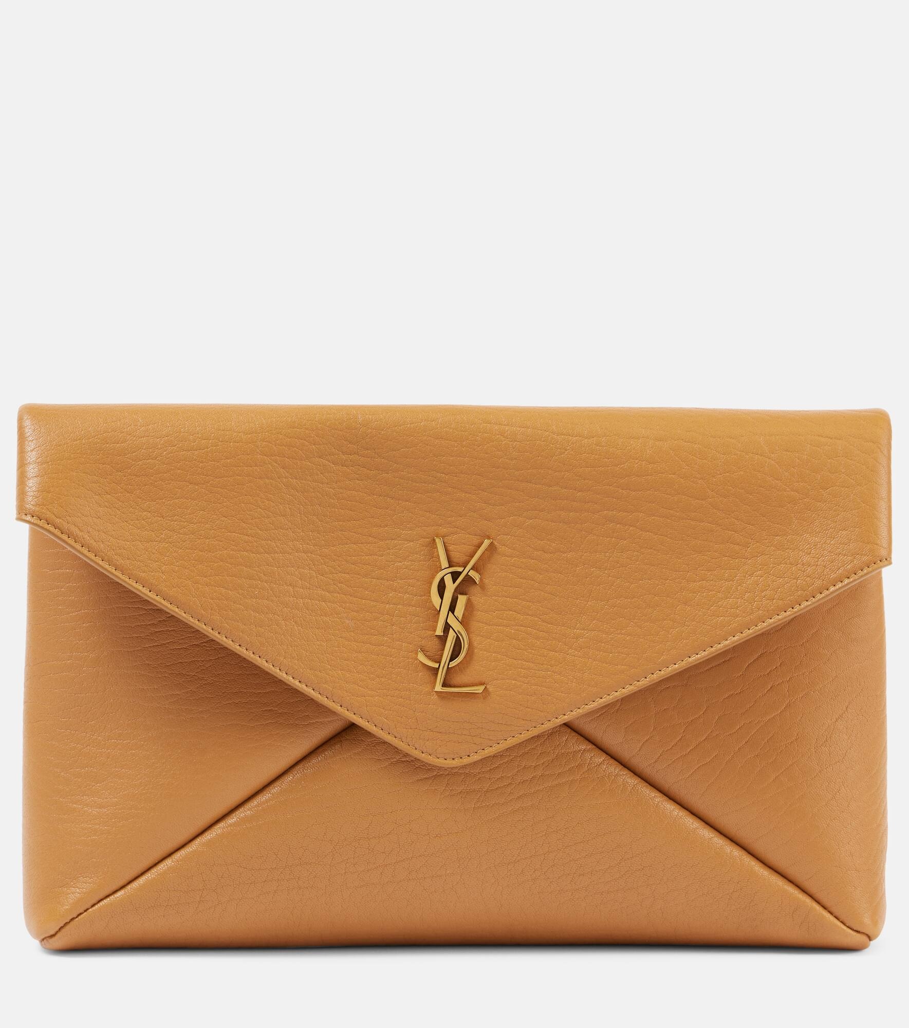 SAINT LAURENT Cassandre Large leather clutch mytheresa REVERSIBLE