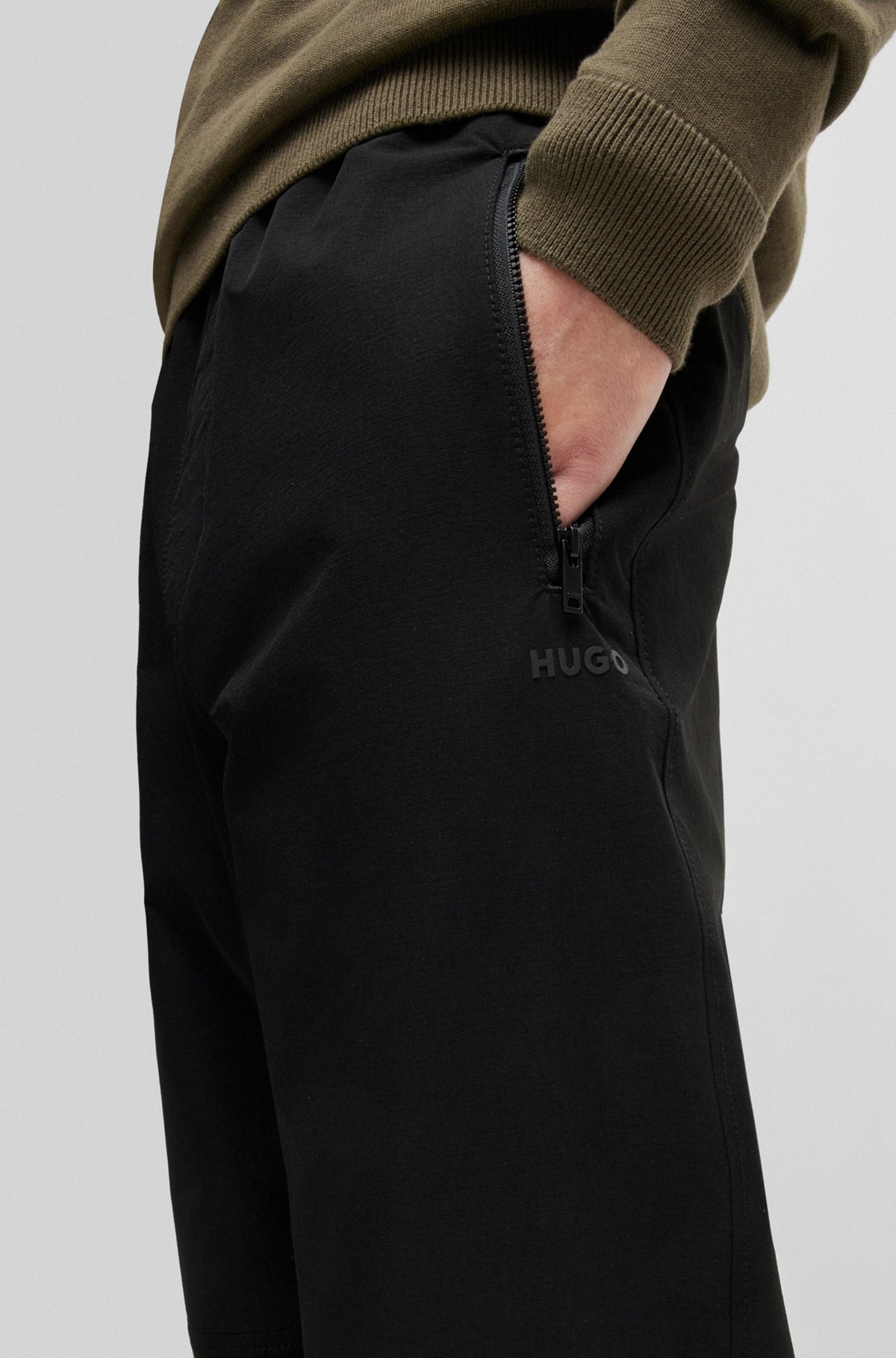 WATER-REPELLENT TROUSERS WITH ADJUSTABLE HEMS - 5