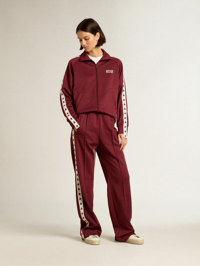 Golden Goose Women’s burgundy joggers with stars on the sides outlook