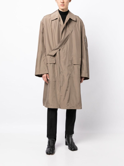 RANDOM IDENTITIES two-pocket strap-detail raincoat outlook