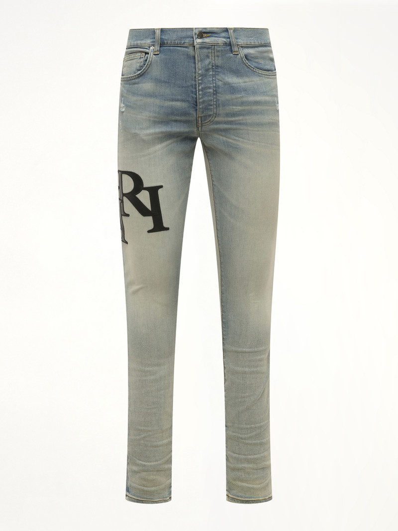 AMIRI Staggered Logo Skinny Jeans in Antique Indigo/Black outlook