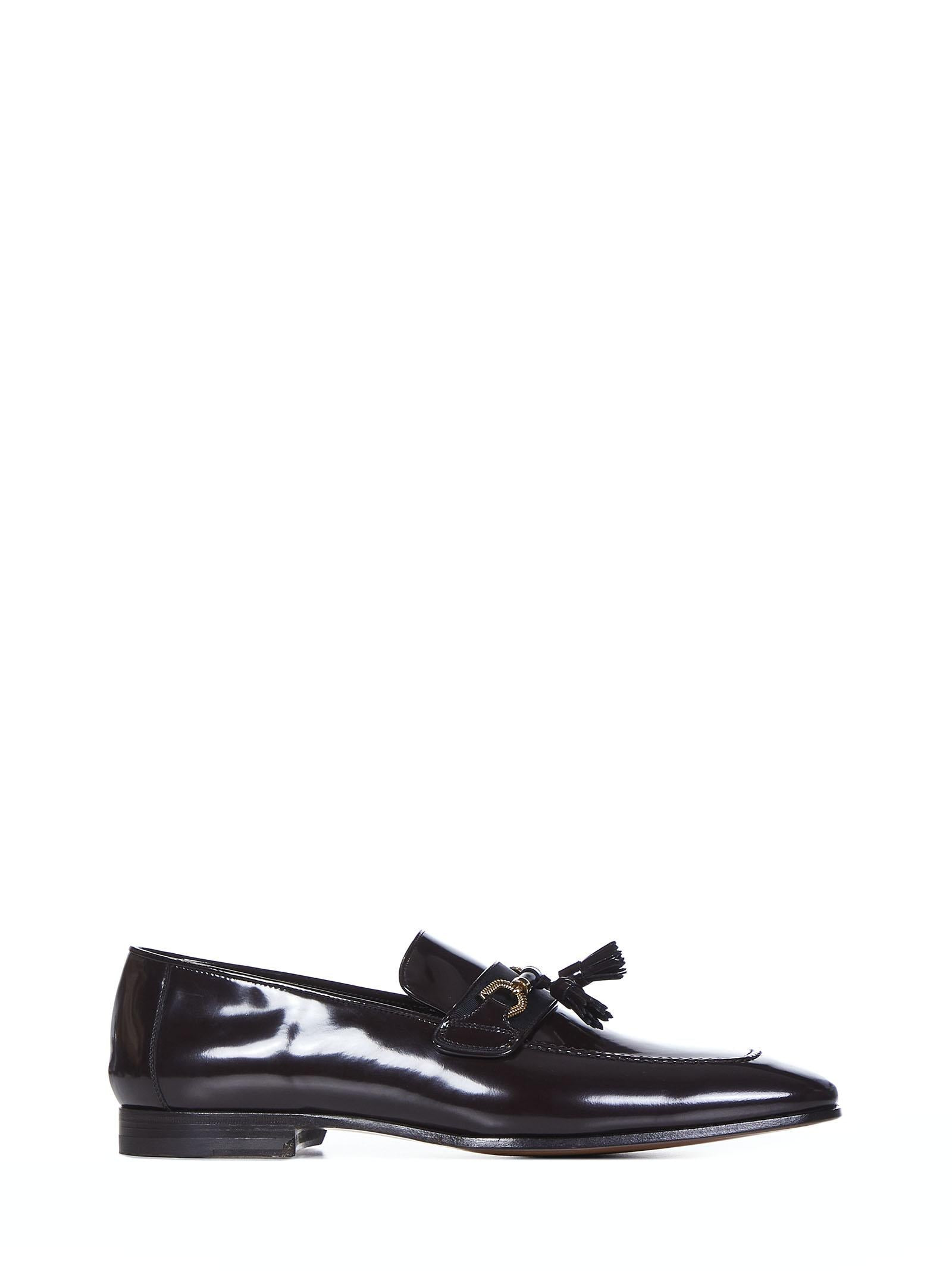 Chocolate-colored patent calfskin loafers with golden metal horsebit and tassels. - 1