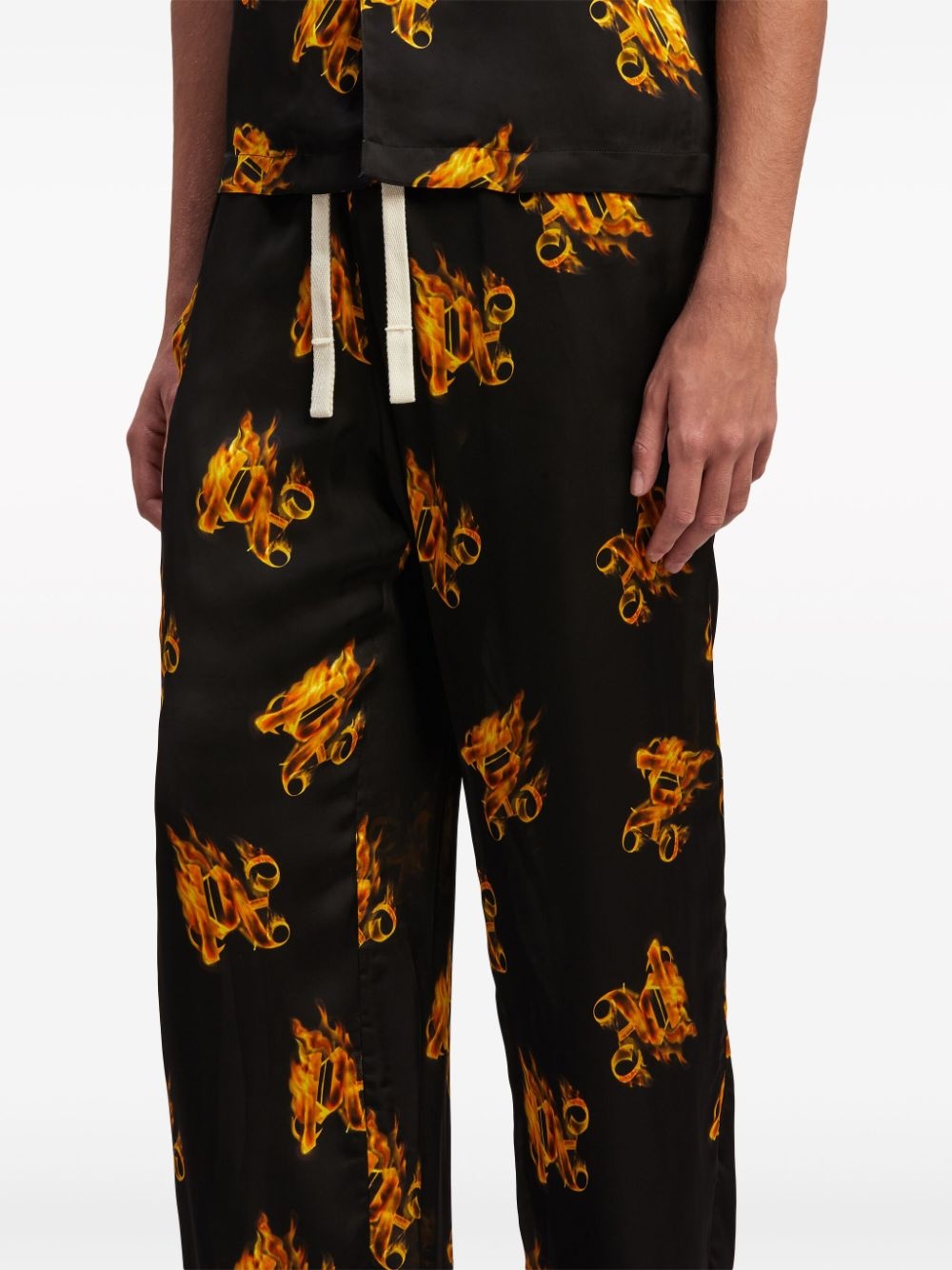 Burning logo-print straight-leg trousers - 6