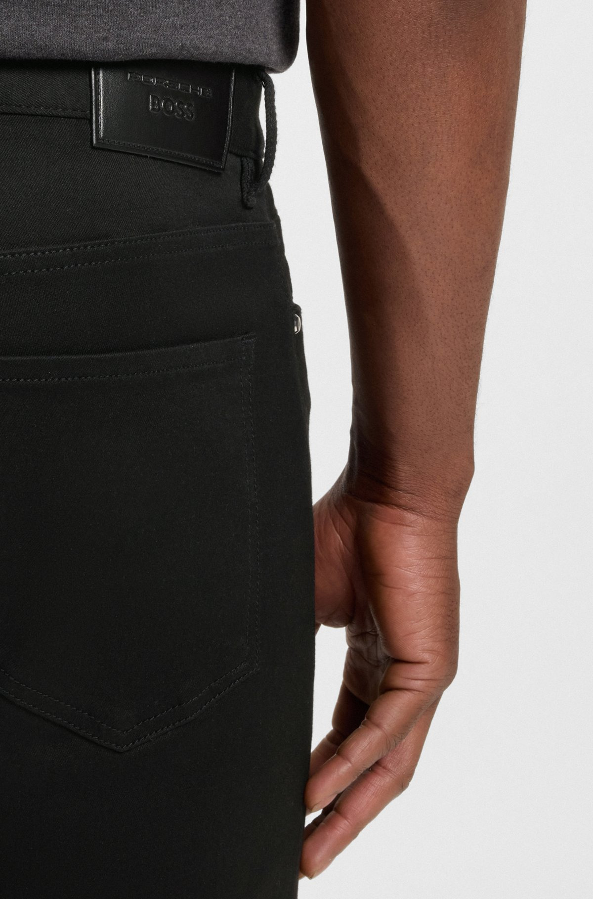 PORSCHE X BOSS TAPERED-FIT JEANS IN BLACK STRETCH DENIM - 5