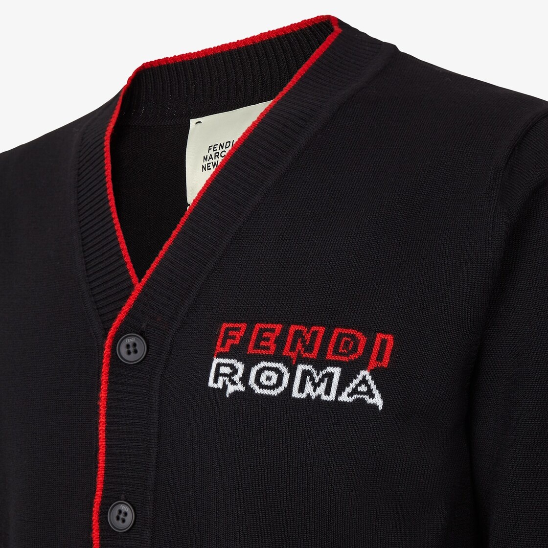 V-neck cardigan fastened with matching buttons. Borders embellished with ribbing. Made in a black kn - 3