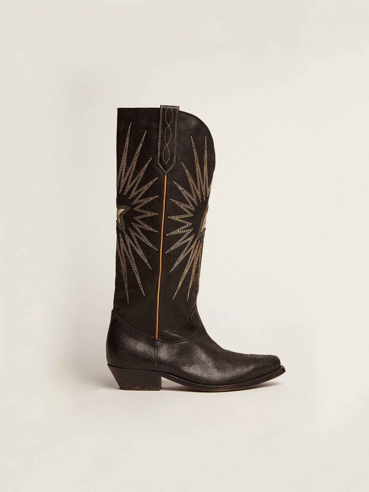 Women's boots in black leather with platinum star inlay - 1