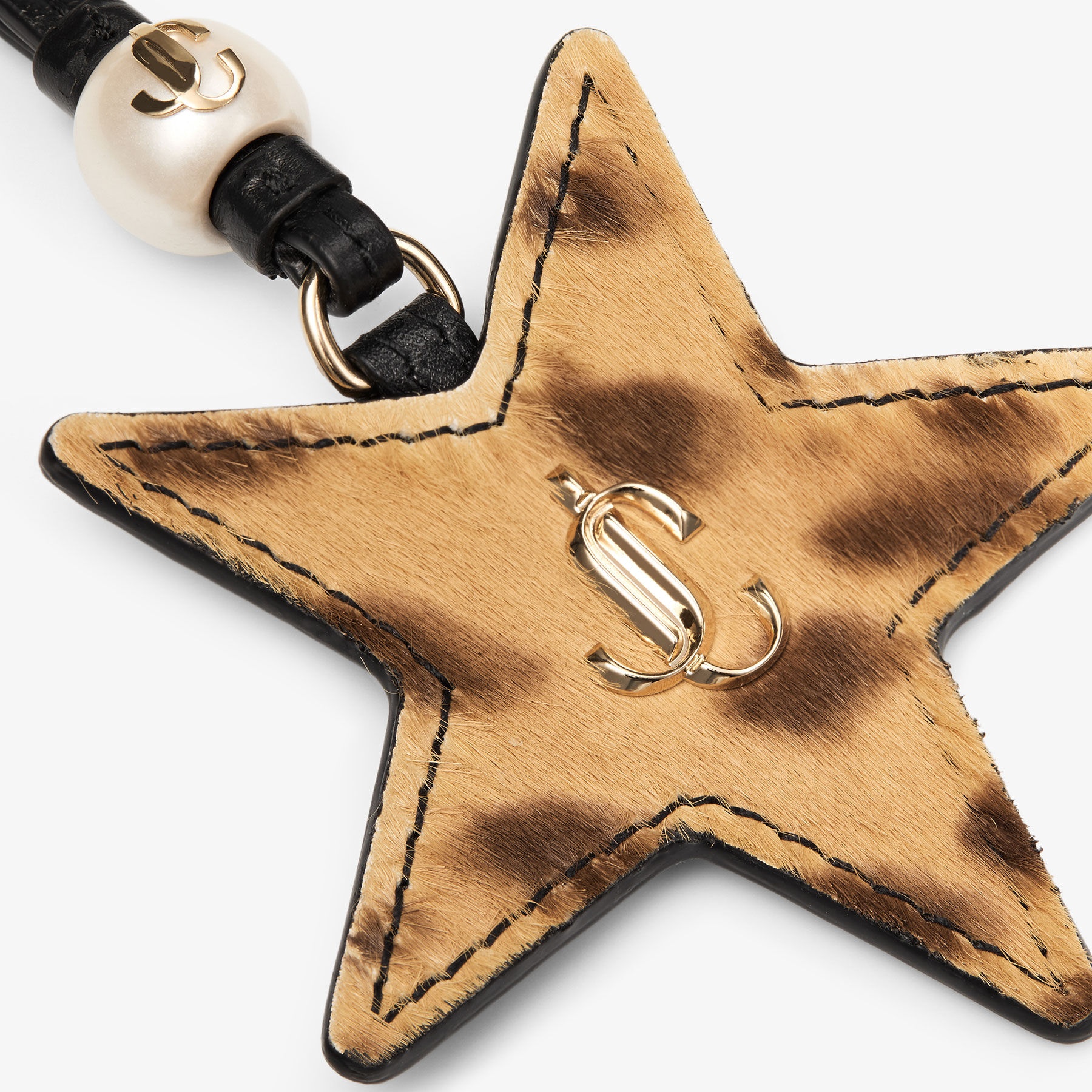 Star Charm
Natural Leopard Print Pony Star Bag Charm - 2