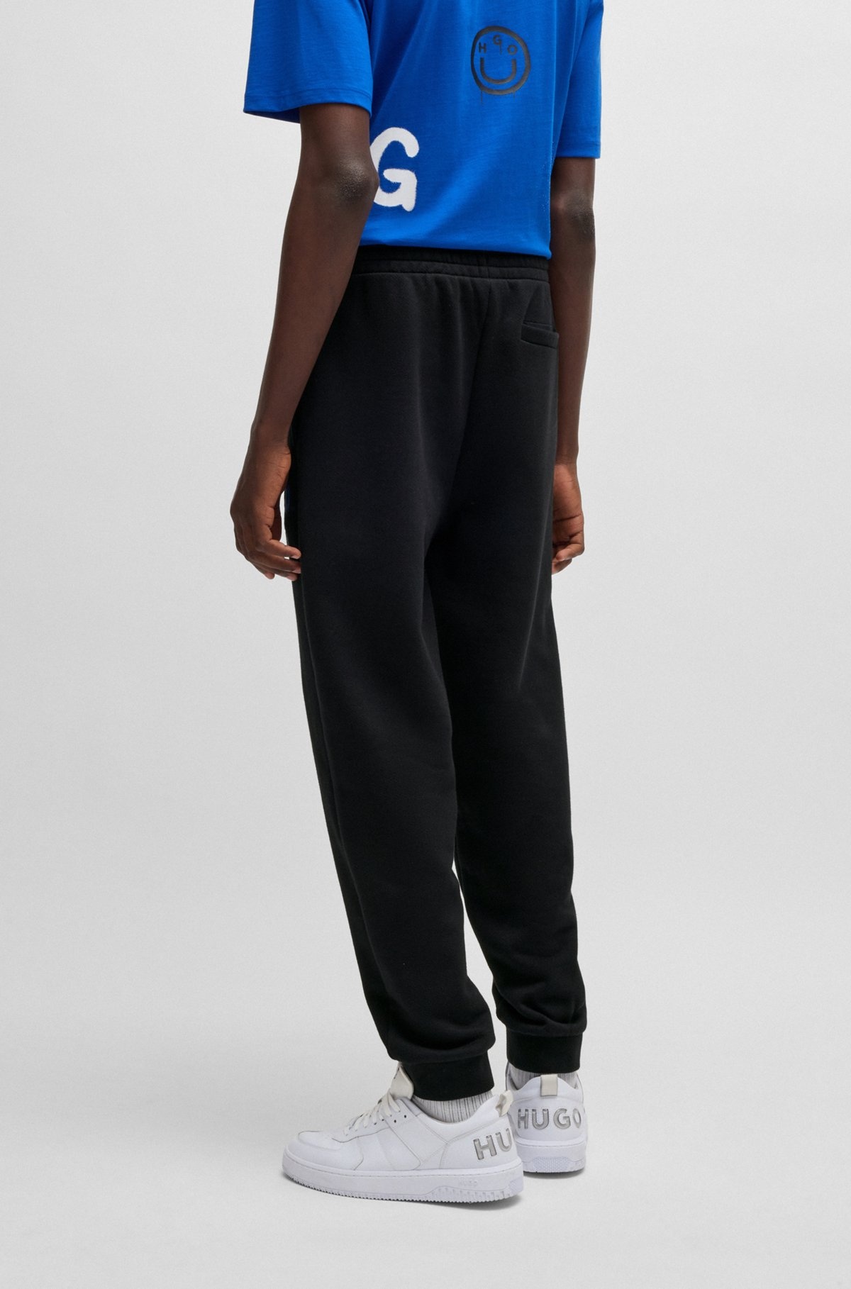 COTTON-TERRY TRACKSUIT BOTTOMS WITH HAPPY HUGO LOGO - 7