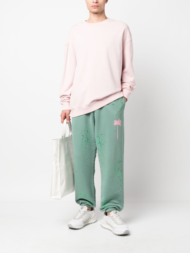 Palm Angels paint-splatter track pants outlook
