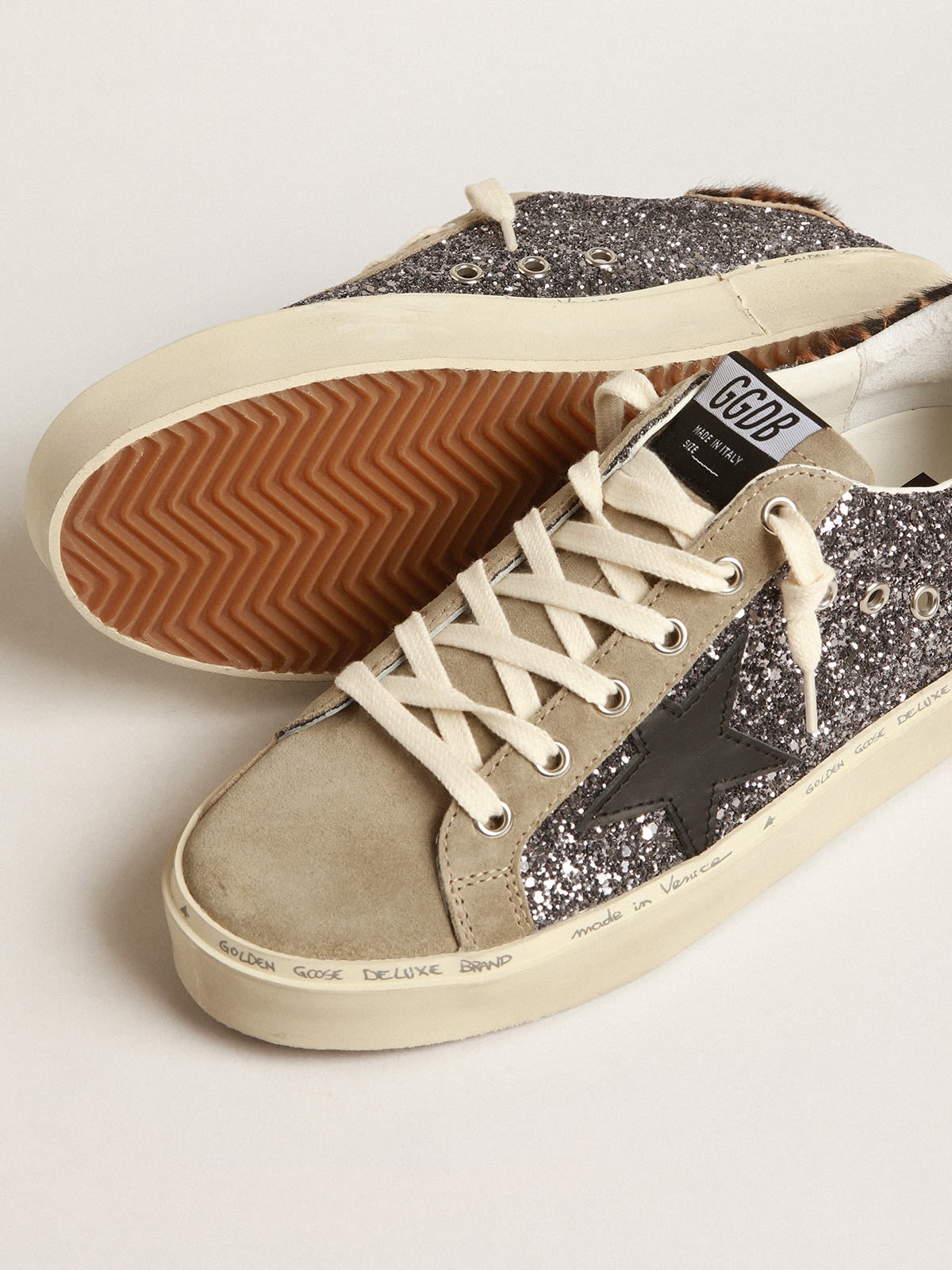 Golden Goose Hi Star in dark gray glitter with a black leather