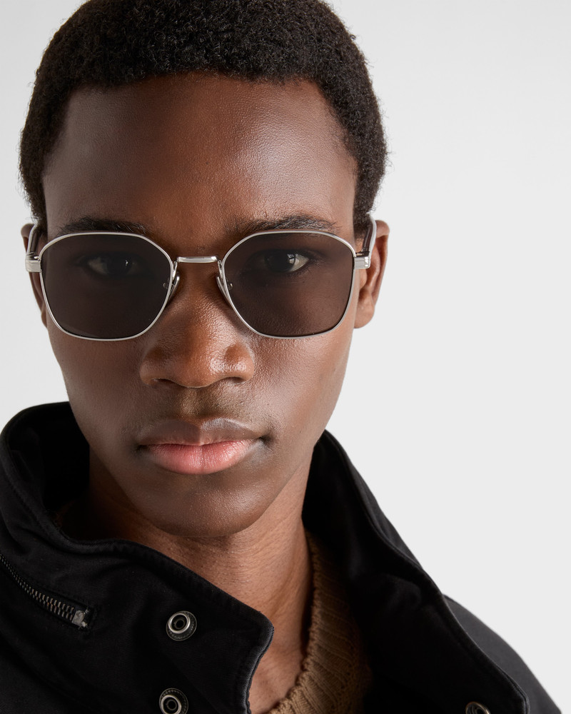 Prada Sunglasses with the iconic metal plaque outlook