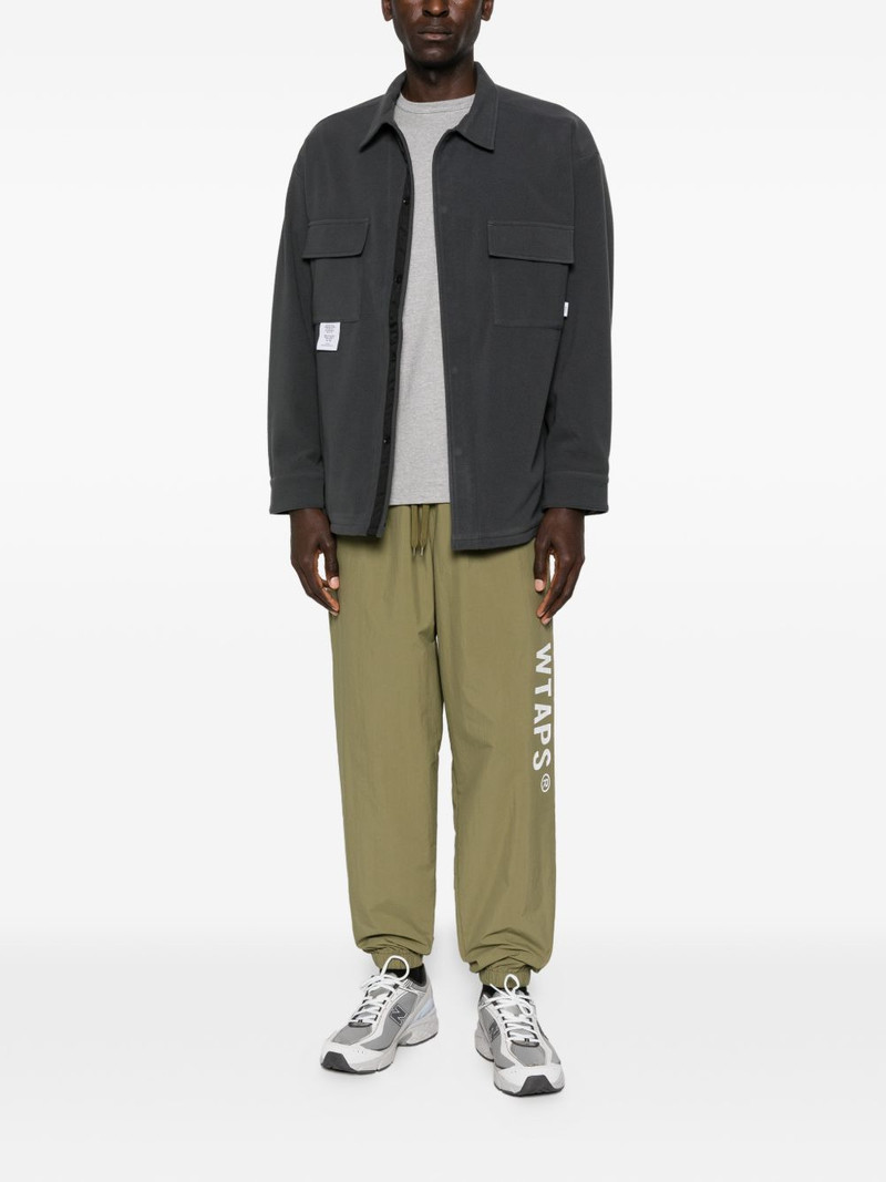 WTAPS logo-print track pants outlook