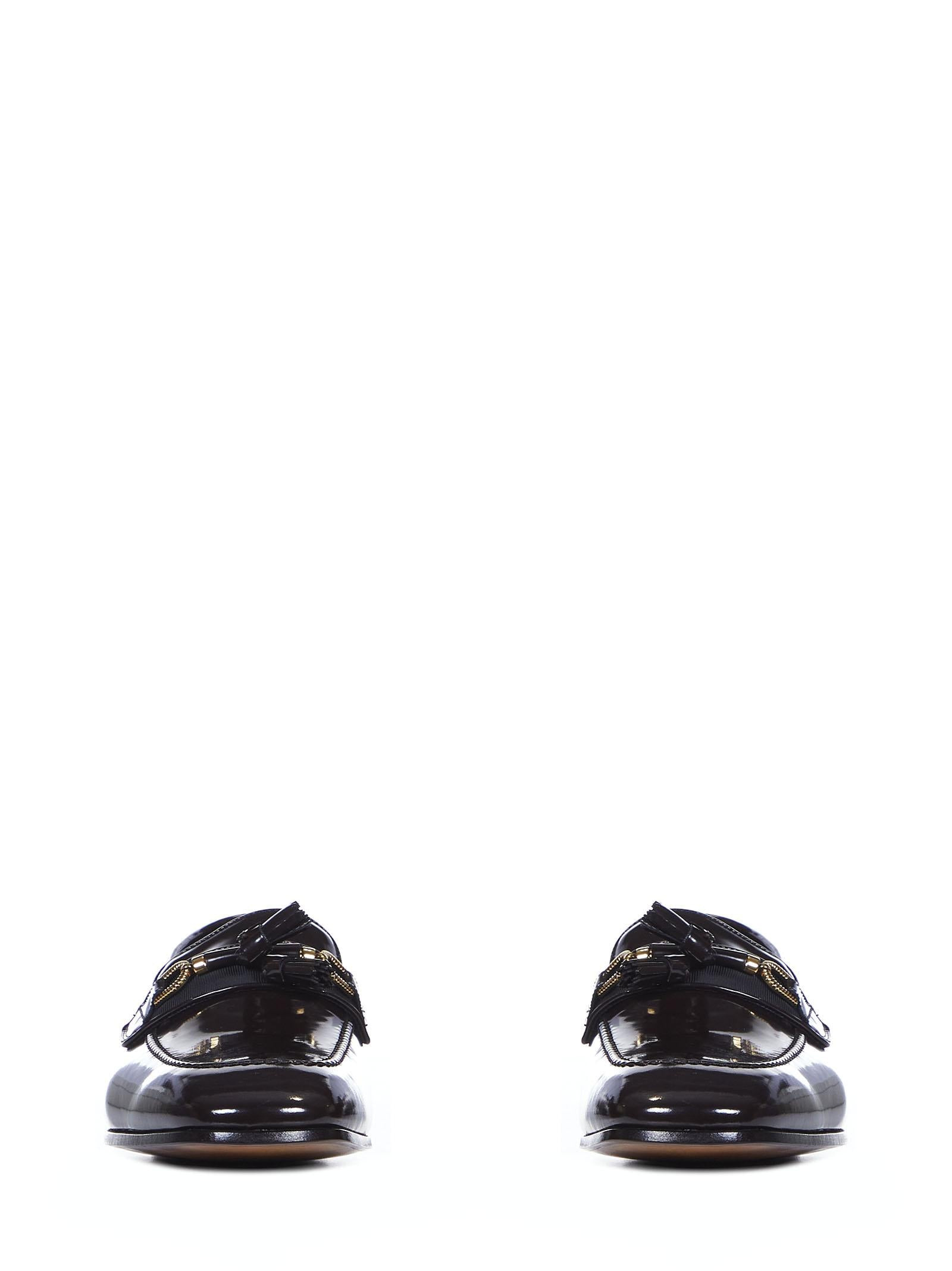 Chocolate-colored patent calfskin loafers with golden metal horsebit and tassels. - 2