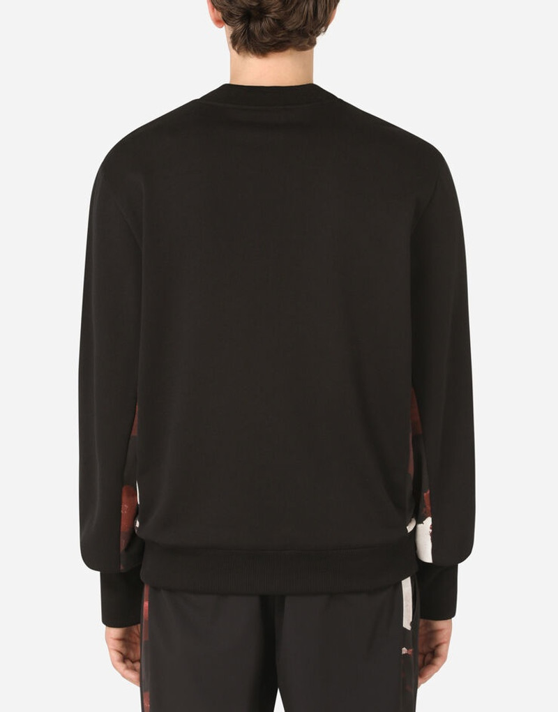 Dolce & Gabbana Round-neck sweatshirt with camouflage-print inserts and embroidery outlook