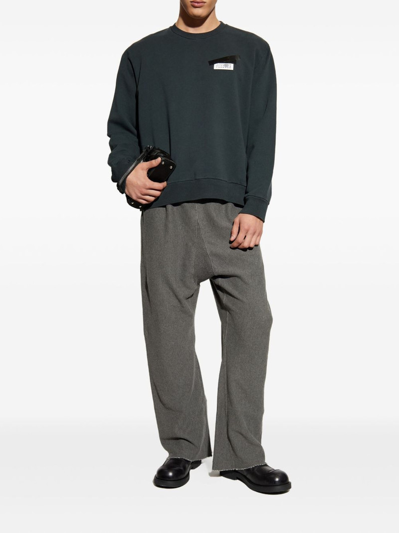 Maison Margiela elastic-waist frayed-hem trousers outlook