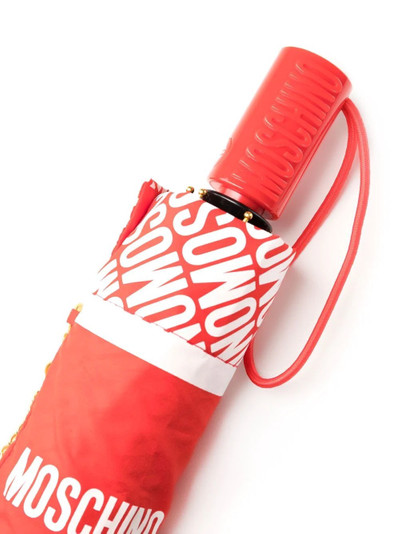 Moschino logo-print compact umbrella outlook